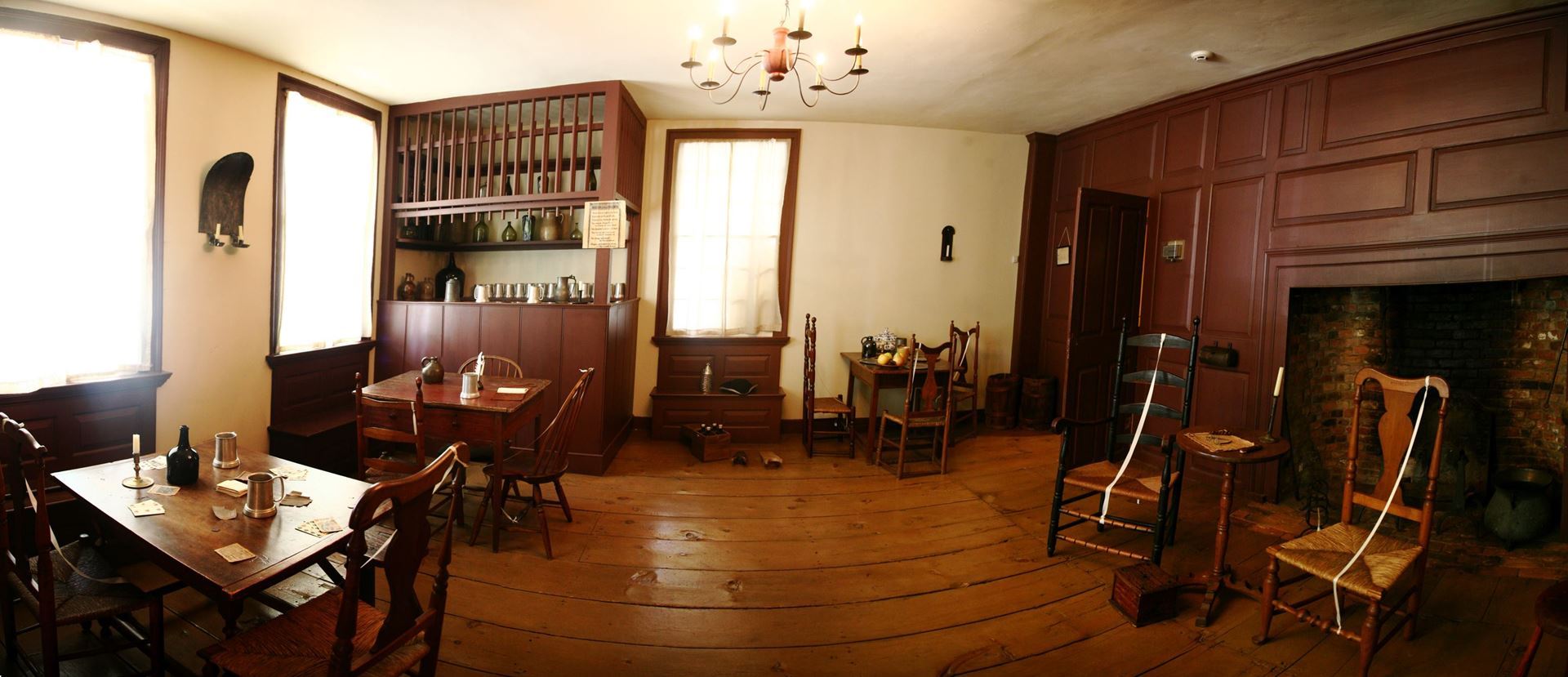 interior image of the Square House Inn, an 18th century building with colonial style furniture and large fireplace